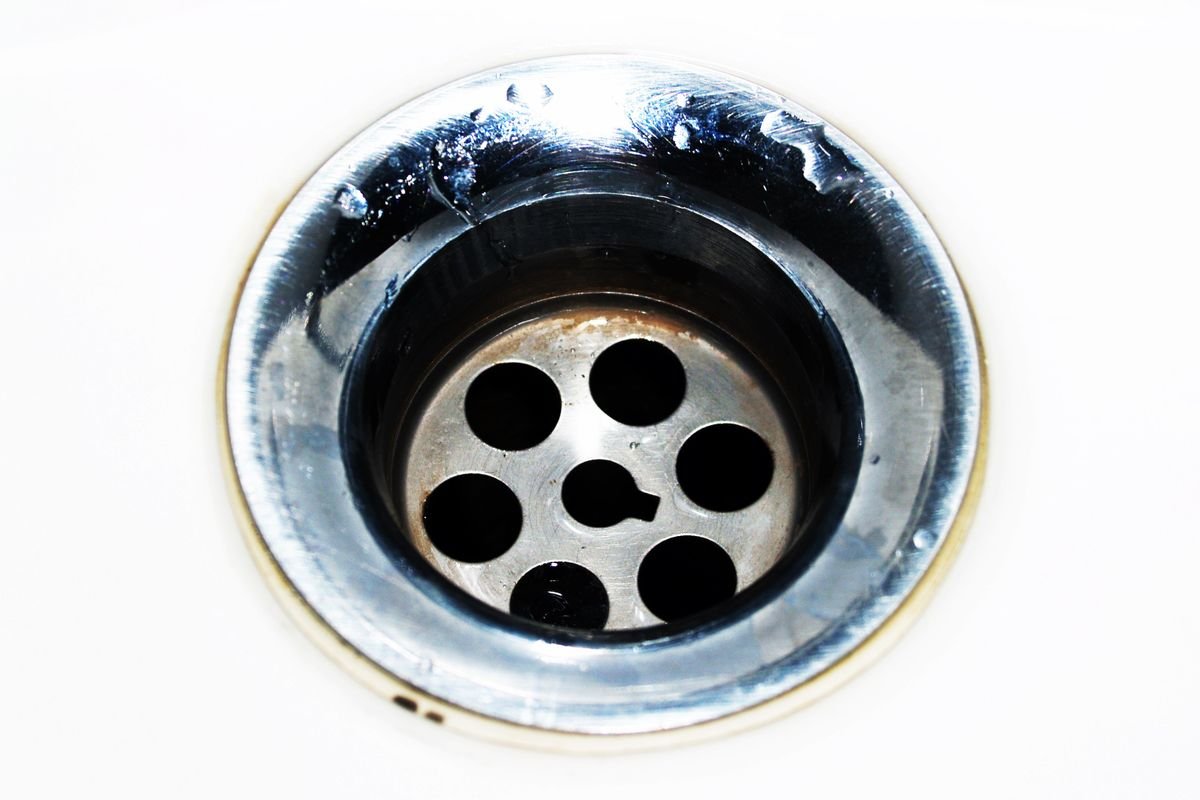 Close view of a household sink drain